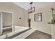 Dining area with modern light fixture and neutral color palette at 10550 W Alexander Rd # 2103, Las Vegas, NV 89129