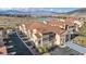 Exterior view of the building with scenic mountain views in the background at 10550 W Alexander Rd # 2103, Las Vegas, NV 89129