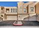 Charming townhome with a two-car garage and a cozy front entryway at 10550 W Alexander Rd # 2103, Las Vegas, NV 89129