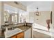 Eat-in kitchen featuring stylish countertops and wooden cabinetry at 10550 W Alexander Rd # 2103, Las Vegas, NV 89129