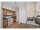 Kitchen with tile backsplash, wooden cabinets, and modern fixtures at 10550 W Alexander Rd # 2103, Las Vegas, NV 89129