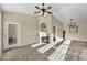 Cozy living room with fireplace, ceiling fan, and access to the outdoors at 10550 W Alexander Rd # 2103, Las Vegas, NV 89129
