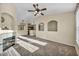 Bright and open living room with a fireplace and an open view to the kitchen at 10550 W Alexander Rd # 2103, Las Vegas, NV 89129