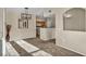 Open-concept living room with a view into the kitchen and stylish decor at 10550 W Alexander Rd # 2103, Las Vegas, NV 89129