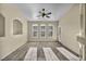 Large living room with natural light, a ceiling fan and a view of the yard at 10550 W Alexander Rd # 2103, Las Vegas, NV 89129