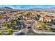 Community aerial view featuring a manicured entrance and well-maintained landscaping at 10550 W Alexander Rd # 2103, Las Vegas, NV 89129