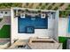 Aerial view of a modern pool with a spa, tanning ledge, waterfall feature, and meticulously landscaped backyard at 12439 Iron Bluff Ave, Las Vegas, NV 89138