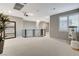 Large bonus room with a chandelier, projector, and movie screen, perfect for entertaining or relaxing at 12439 Iron Bluff Ave, Las Vegas, NV 89138