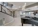 Elegant foyer with a curved staircase, modern railings, and high ceilings, seamlessly flowing into open living spaces at 12439 Iron Bluff Ave, Las Vegas, NV 89138