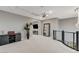 Bright loft with a home theater setup and modern railing at 12439 Iron Bluff Ave, Las Vegas, NV 89138