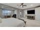 Large main bedroom with an adjacent sitting area and balcony at 12439 Iron Bluff Ave, Las Vegas, NV 89138