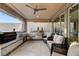 Covered outdoor kitchen featuring built-in stainless steel appliances and a seating area at 12439 Iron Bluff Ave, Las Vegas, NV 89138