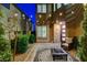 Inviting outdoor patio featuring pavers, seating, fire pit, and string lights, perfect for cozy evenings at 12439 Iron Bluff Ave, Las Vegas, NV 89138