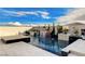 A serene pool area features a pool with a spa and a stone-accented waterfall at 12439 Iron Bluff Ave, Las Vegas, NV 89138