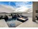 A serene pool area features a pool with a spa and a stone-accented waterfall at 12439 Iron Bluff Ave, Las Vegas, NV 89138