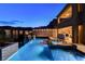 The pool boasts a spa and a waterfall, surrounded by a patio and backyard at 12439 Iron Bluff Ave, Las Vegas, NV 89138