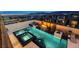 A sparkling pool, hot tub, and outdoor lounge area, perfect for entertaining at 12439 Iron Bluff Ave, Las Vegas, NV 89138