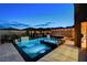 An elegant pool area features a sparkling pool and a spa with a waterfall feature at 12439 Iron Bluff Ave, Las Vegas, NV 89138