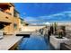 A stunning pool area features a sparkling pool with a spa and a stone-accented waterfall at 12439 Iron Bluff Ave, Las Vegas, NV 89138
