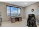 Cozy sitting room with mountain views, a desk, and comfortable massage chair at 12439 Iron Bluff Ave, Las Vegas, NV 89138