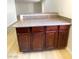 Granite countertop and brown cabinets in this well-lit bar area at 4421 Alexis Dr # 429, Las Vegas, NV 89103