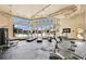 Well-equipped fitness center with treadmills, weights, and large windows for a bright workout space at 4421 Alexis Dr # 429, Las Vegas, NV 89103