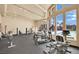Bright fitness center featuring ample workout equipment with views of the pool and palm trees at 4421 Alexis Dr # 429, Las Vegas, NV 89103