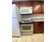 Kitchen featuring stainless steel oven and microwave and dark cabinetry at 4421 Alexis Dr # 429, Las Vegas, NV 89103