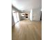 Bright living room area featuring modern wood-look flooring and access to the balcony at 4421 Alexis Dr # 429, Las Vegas, NV 89103