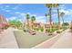 Community playground featuring a slide, bench, and mature trees in a well-maintained outdoor space at 4421 Alexis Dr # 429, Las Vegas, NV 89103