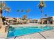 Inviting community pool featuring comfortable seating options and large shade umbrellas, perfect for enjoying the outdoors at 4421 Alexis Dr # 429, Las Vegas, NV 89103