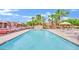 Large swimming pool surrounded by lounge chairs and lush landscaping, a perfect oasis at 4421 Alexis Dr # 429, Las Vegas, NV 89103