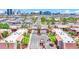 Aerial street view of the community featuring mature trees, walkways, and distant cityscape at 4421 Alexis Dr # 429, Las Vegas, NV 89103