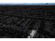 Focused aerial view of a well-lit home with solar panels amid a darkened neighborhood at 10235 Headrick Dr, Las Vegas, NV 89166