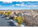 Neighborhood street view of charming two-story homes with desert landscaping at 10235 Headrick Dr, Las Vegas, NV 89166