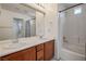 Bright bathroom with double sinks, tile backsplash, and shower-tub combo at 10235 Headrick Dr, Las Vegas, NV 89166