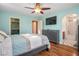 Bright bedroom with hardwood floors, walk-in closet, and an ensuite bathroom at 10235 Headrick Dr, Las Vegas, NV 89166