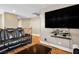 Relaxing living area with large TV, comfy couch, and bright lighting at 10235 Headrick Dr, Las Vegas, NV 89166