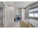 Comfortable bedroom featuring a built-in desk and shelving, offering a functional workspace at 10332 Stroma Ave, Las Vegas, NV 89166