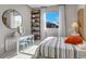 Bright bedroom with a playful mural, shelving unit, desk, and a sunlit window at 10332 Stroma Ave, Las Vegas, NV 89166