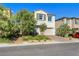 Charming two-story home with a two car garage, well-maintained landscaping, and a brick paver driveway at 10332 Stroma Ave, Las Vegas, NV 89166