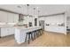Spacious kitchen with an island, barstools, stainless steel appliances, and ample storage at 10332 Stroma Ave, Las Vegas, NV 89166