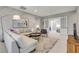 Elegant living room featuring a stylish couch, contemporary decor, and ample space for relaxation at 10332 Stroma Ave, Las Vegas, NV 89166