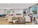 Bright living room featuring a modern fireplace, comfortable seating, large windows, and stylish decor at 10332 Stroma Ave, Las Vegas, NV 89166