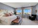 This sunny main bedroom features large windows with backyard views at 10332 Stroma Ave, Las Vegas, NV 89166