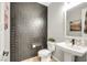 Sleek powder room with eye-catching accent wall, modern vanity, and neutral wall color at 10332 Stroma Ave, Las Vegas, NV 89166