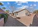 The backyard features low-maintenance landscaping with gravel and a charming desert-style aesthetic, ideal for outdoor enjoyment at 1047 Amber Gate St, Henderson, NV 89002