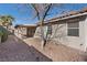 A peaceful backyard with a covered patio and gravel landscaping for minimal maintenance at 1047 Amber Gate St, Henderson, NV 89002