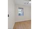 Light and bright bedroom with wood-look floors, neutral colors, and a ceiling fan at 1047 Amber Gate St, Henderson, NV 89002