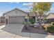 Charming single-story home with well-maintained landscaping, a two car garage and inviting curb appeal at 1047 Amber Gate St, Henderson, NV 89002